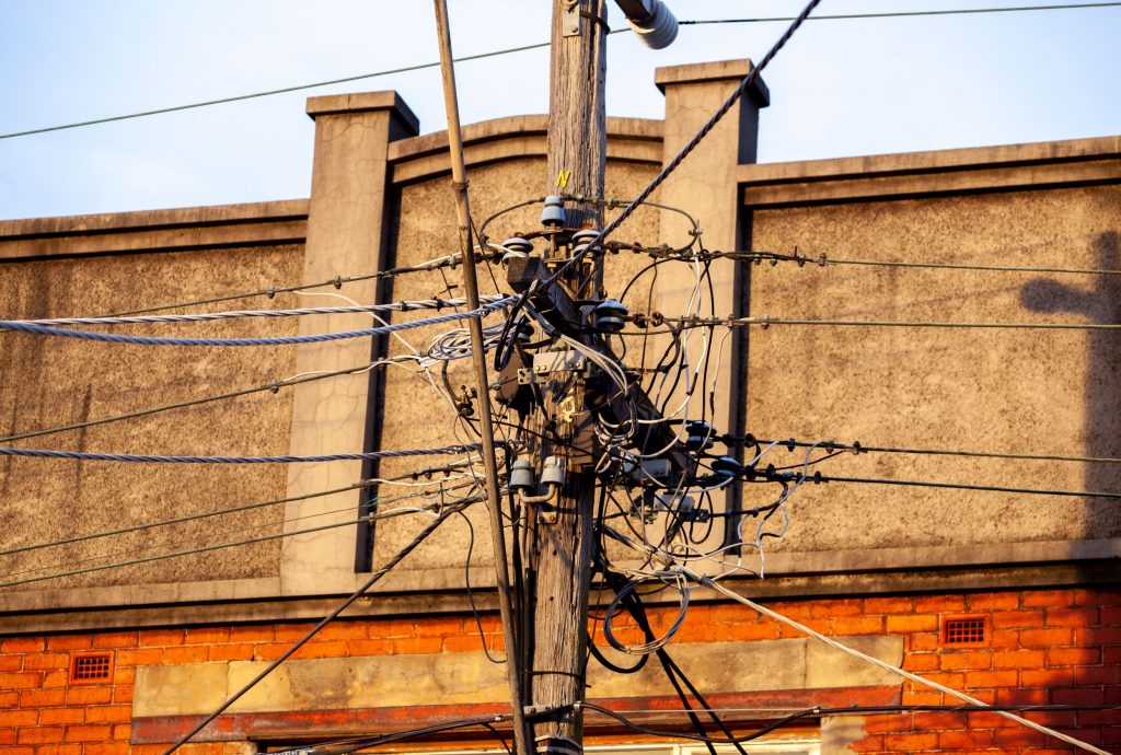 a complex web of tangled power lines and wires