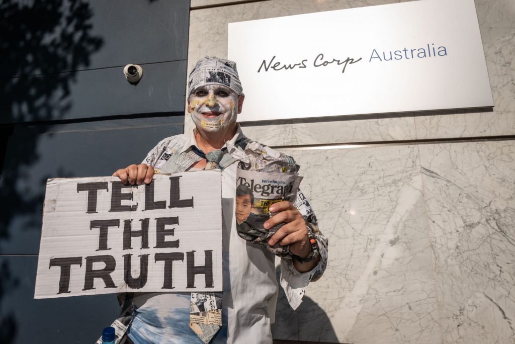 Climate activists protest in front of News Corp Australia headquarters in Sydney calling the Murdoch press liars, January 2020.
