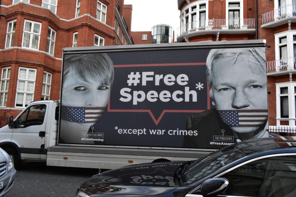 The Wikileaks truck passing through the streets of London spreading awareness of the price of free speech showing gagged whistleblower Chelsea Manning & Wikileaks founder and journalist Julian Assange. 