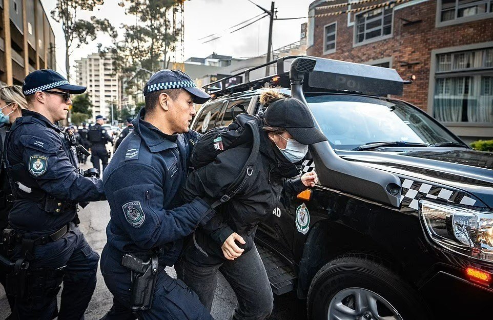Police arresting a young Blockade Australia activist at climate action week in Sydney 27 June - 2 July 2022