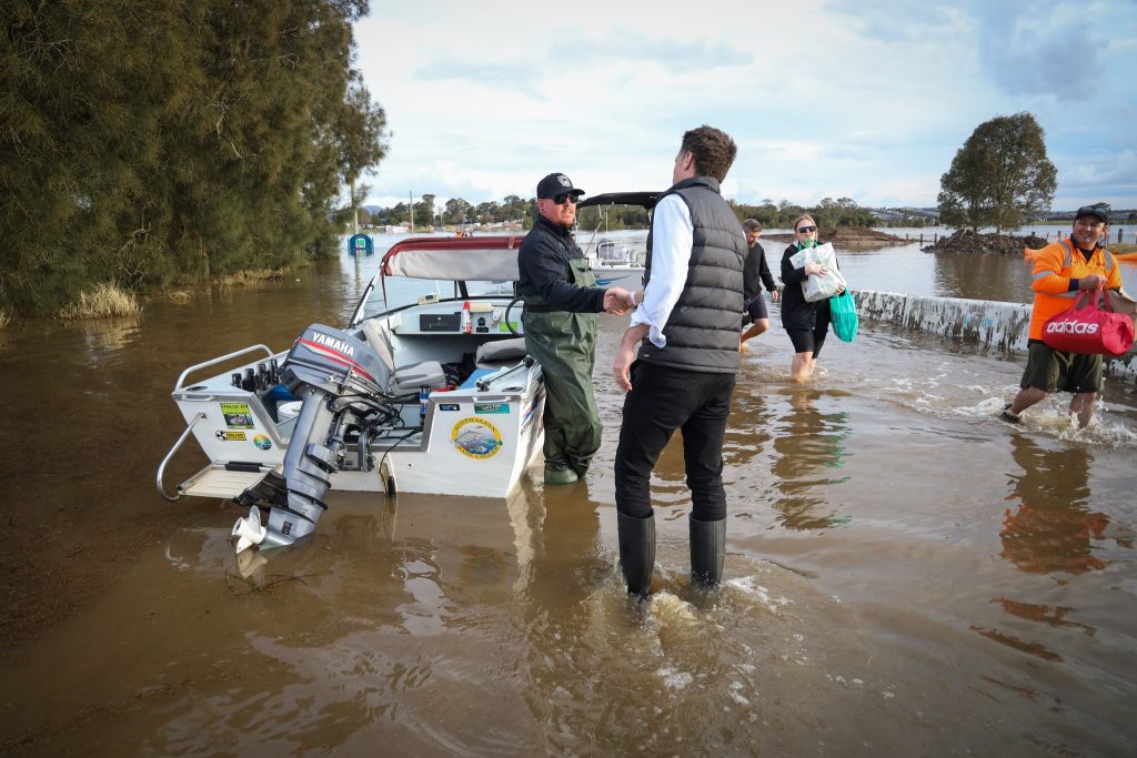 Chris Minns visiting flood affected communities near Maitland in July 2022. Minns and his party could be agreeing that the threats from climate change are real and that protesters such as Deanna CoCo are motivated by a sense of desperation. 