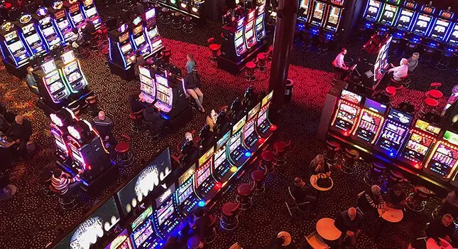 A large club room filled with hundreds of pokie machines is a very common site in Australia